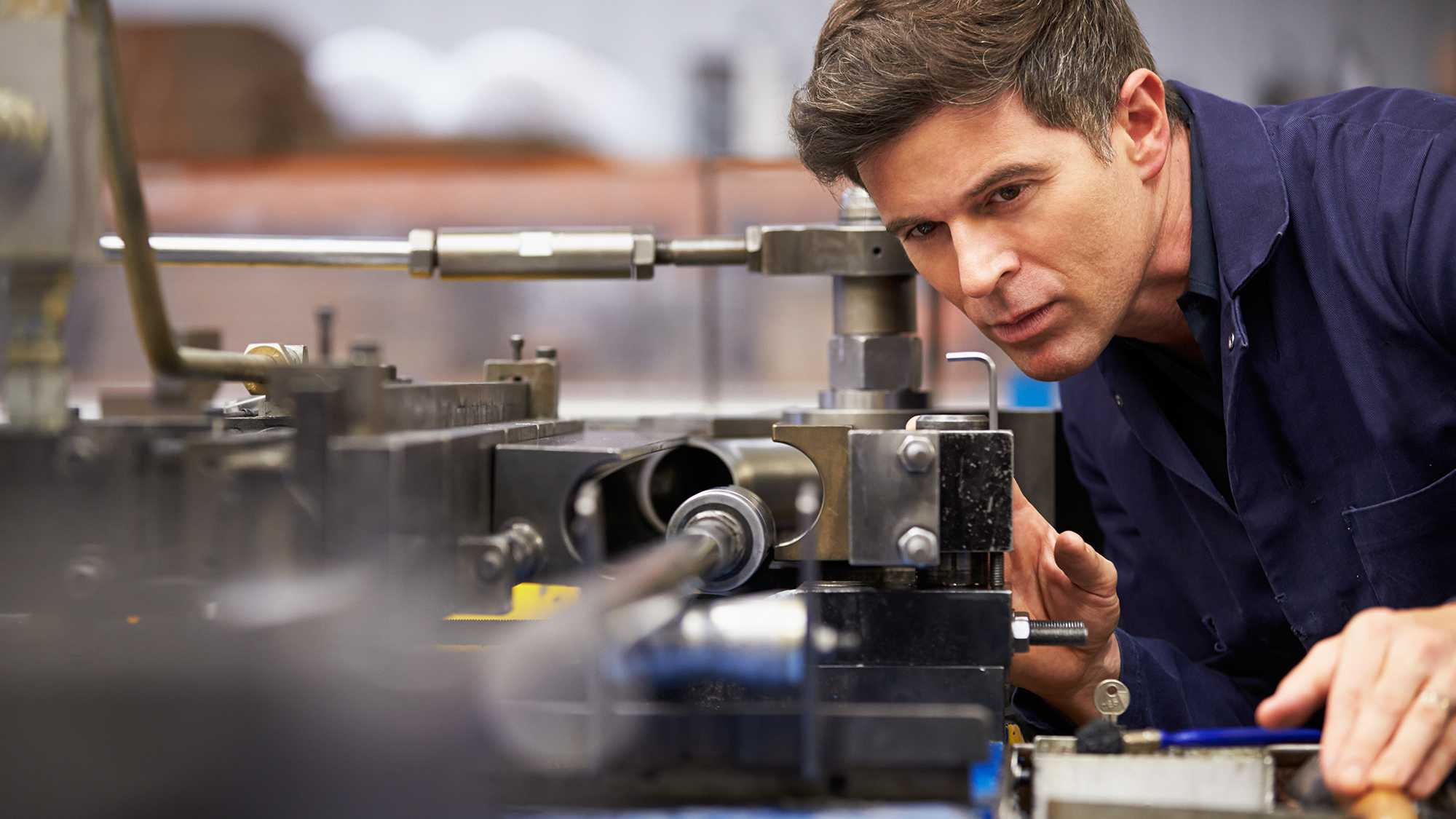 Man working at machine in industry