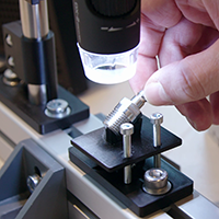 a bolt is being insprcted by a visual device