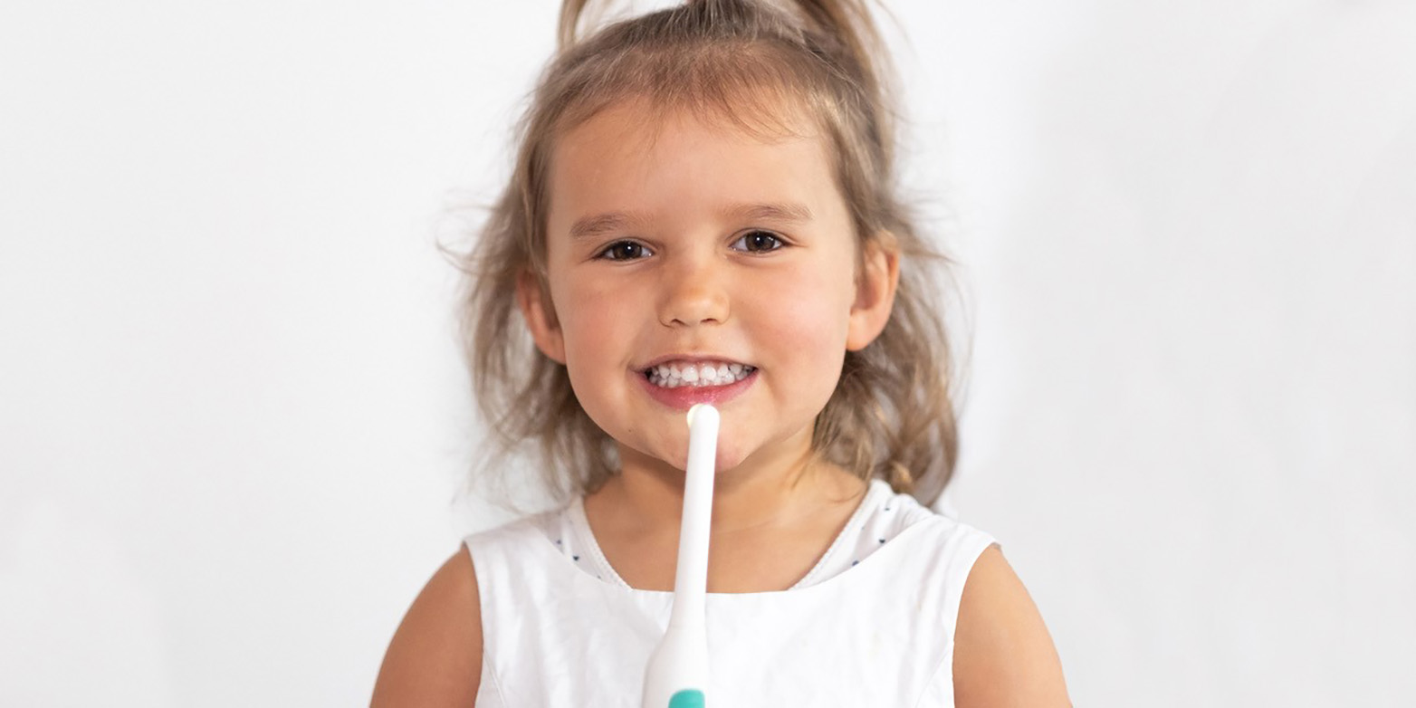 child with Zaamigo in her hand