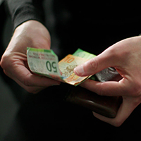 person with bank notes in hand