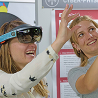 2 women testing AR glasses