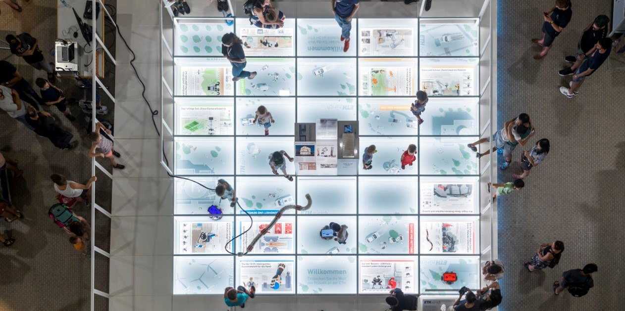 illuminated floor tiles with people walking on them