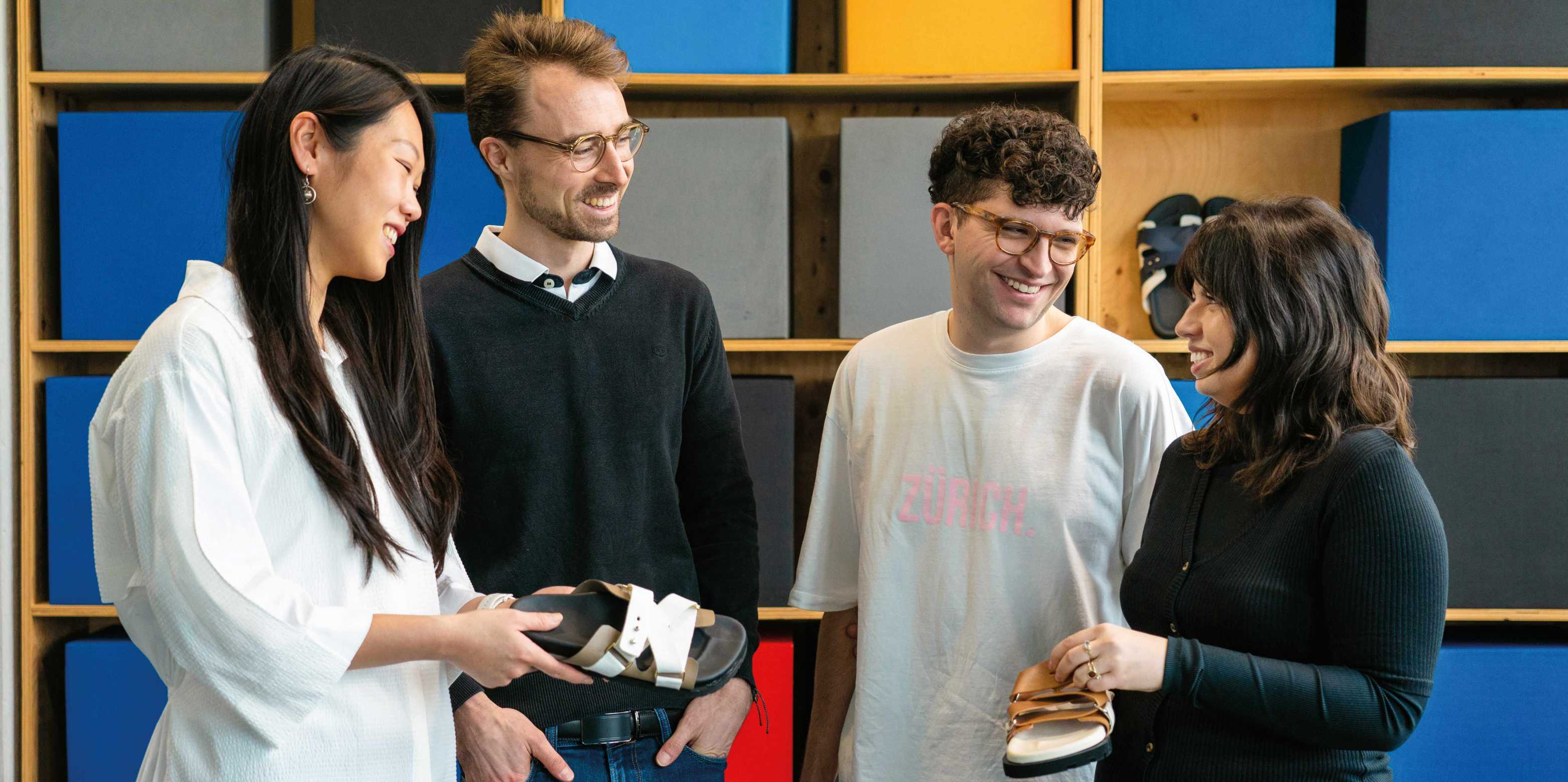 four students with their sandals