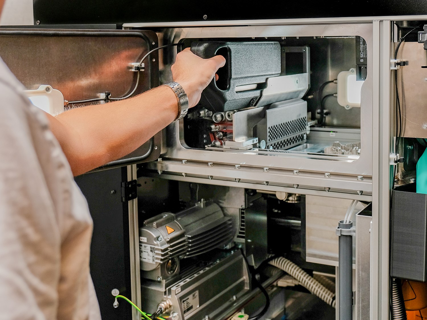 Person changes cartridge in machine