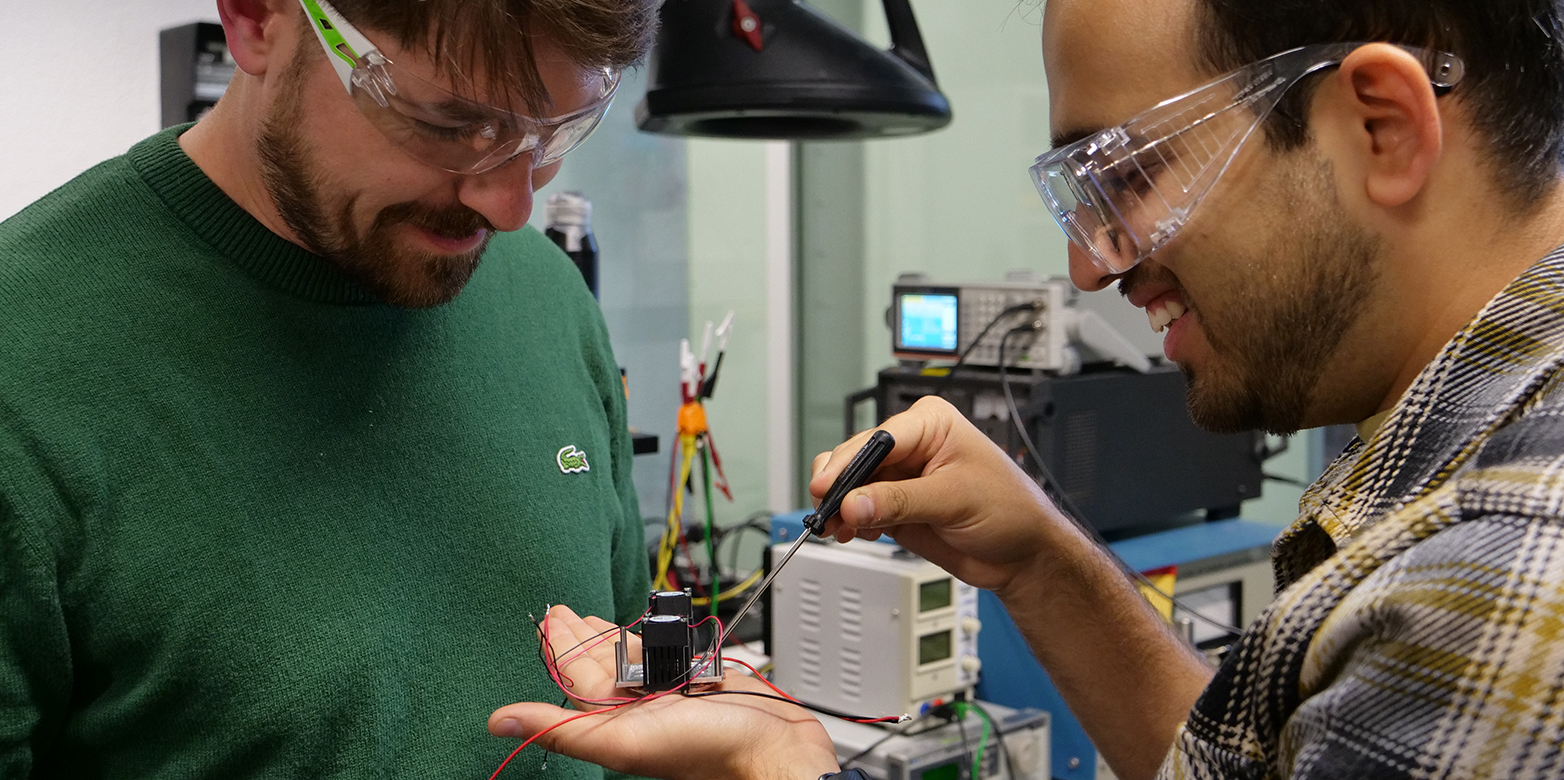two researchers are preparing slides
