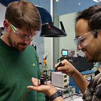 Two researchers are testing something